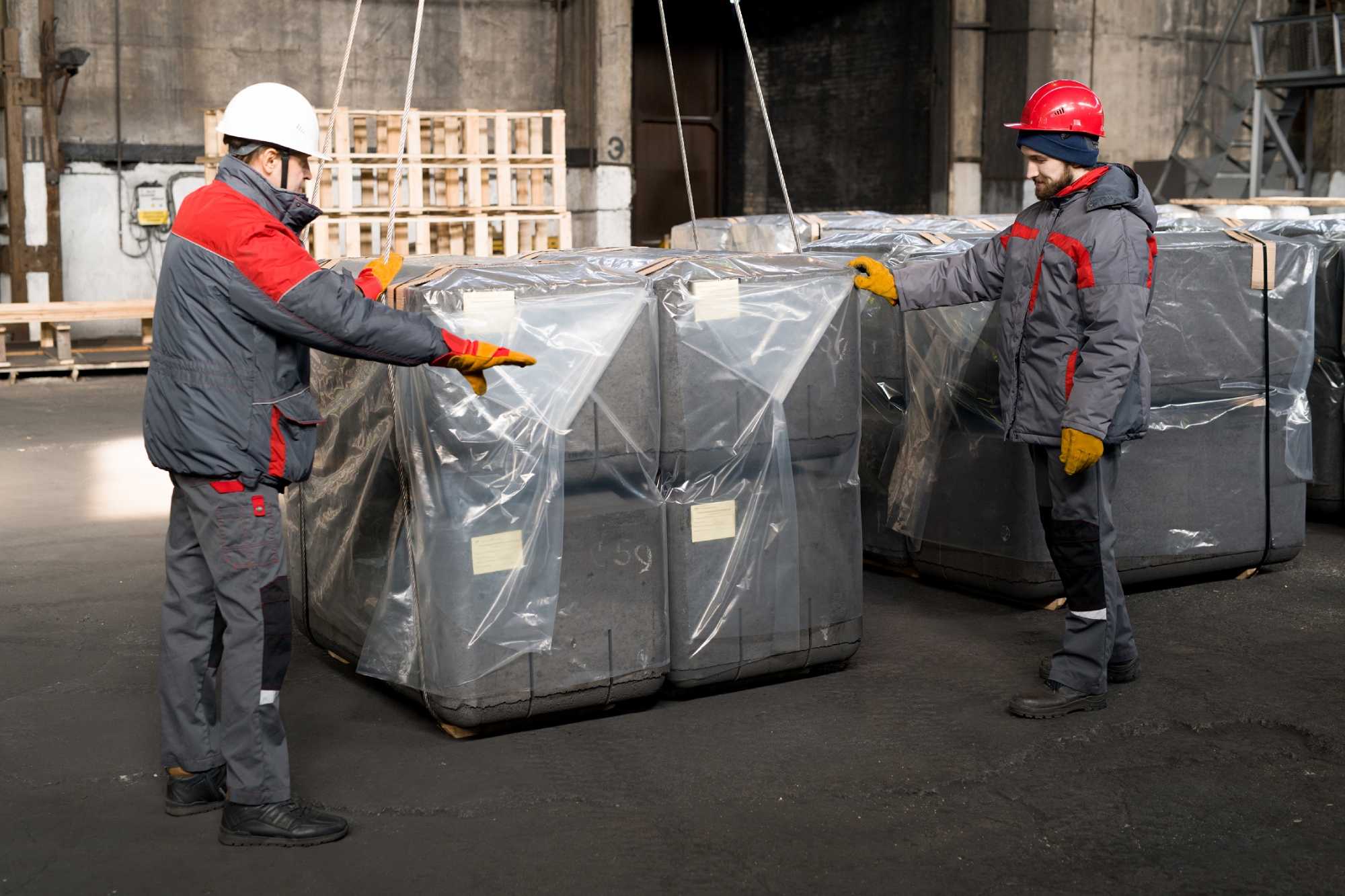 Workers Packing Construction Blocks